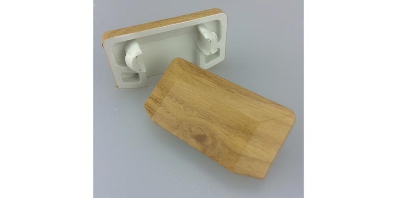 Wood grain finish drain hole covers now available